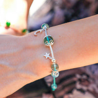 Sterling silver bracelet with moon and star charms